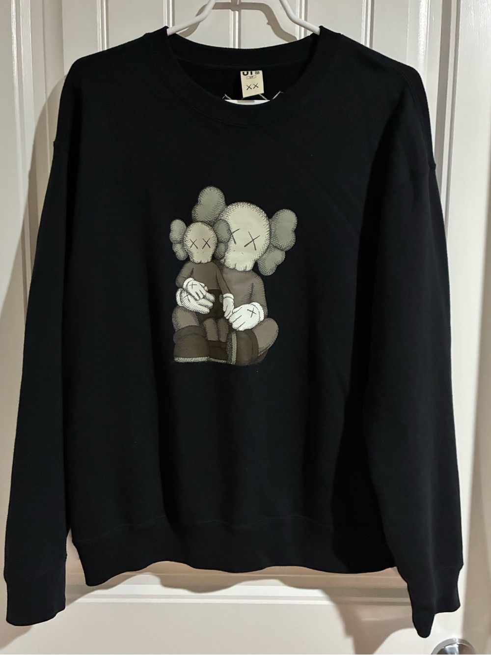 Uniqlo Black Crewneck Sweatshirt with KAWS-style Character Print